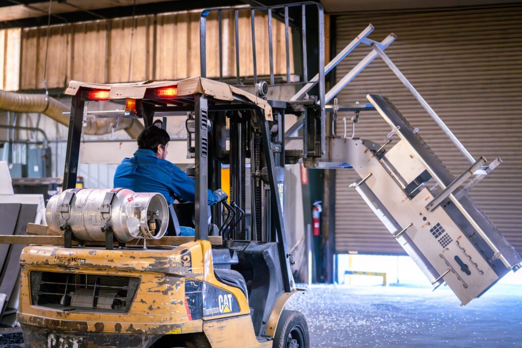 Forklift moving completed stainless steel fabricated unit for shipping