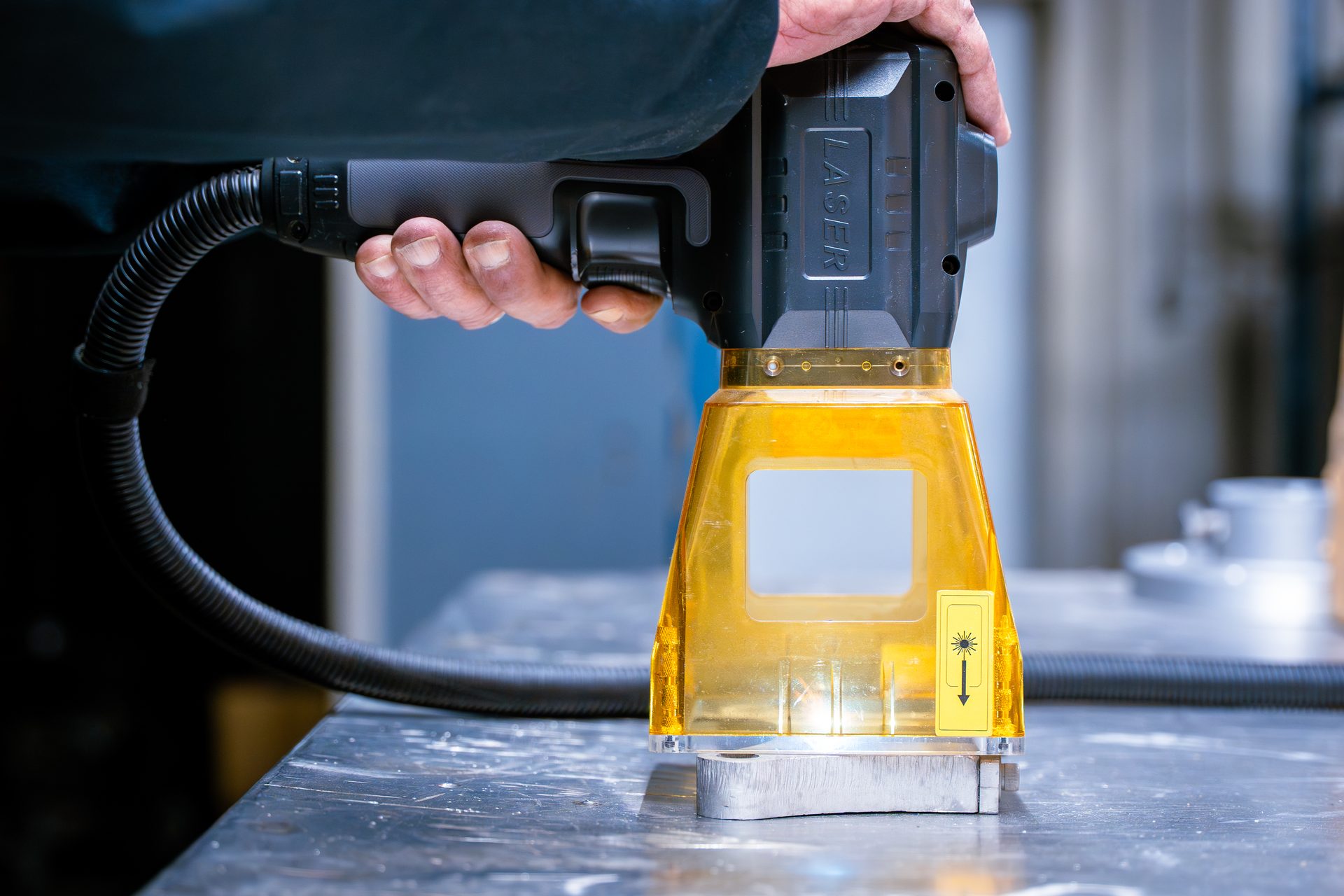 Precision handheld laser engraving equipment in use