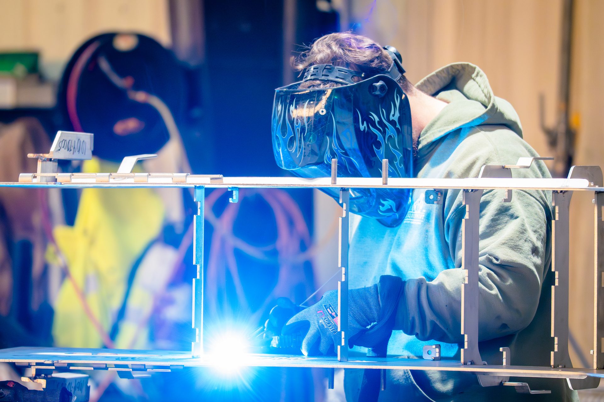 TIG welding with blue arc on stainless steel conveyor frame